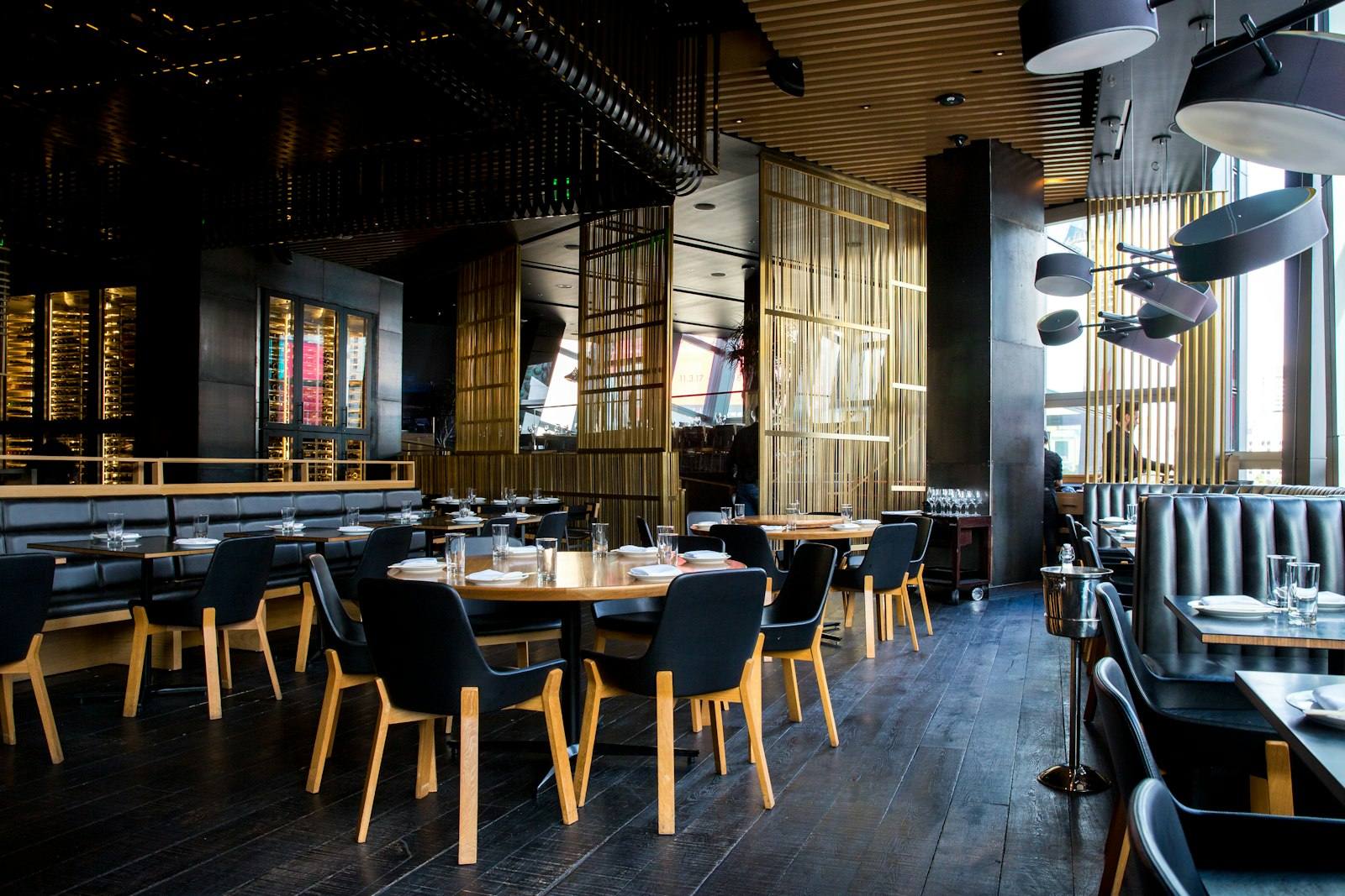 An empty restaurant dining room set with tables and booths